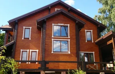Современный дизайн дома из бруса на фото