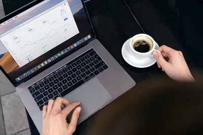 laptop on wooden table with coffee cup, phone, book, glasses and cactus on  top view Stock Photo | Adobe Stock