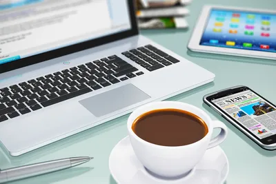 Laptop and cup of coffee on old wooden table Stock Photo by ©Kitzcorner  77270446