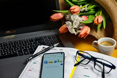 Office desk with coffee cup, blank notebook, black pen, laptop computer and  plant pot, top view design Stock Photo | Adobe Stock