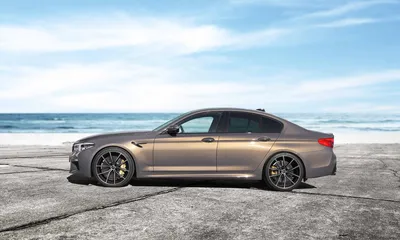 New BMW M5 F90 LCI Competition in a red color on the forest road. Kyiv,  Ukraine - June 2021. Stock Photo | Adobe Stock