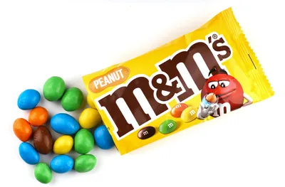 Turin, Italy - october 15, 2022: M and Ms candies , It is a trademark of  Mars Inc, multicolored milk chocolate balls come out of package isolated on  w Stock Photo - Alamy