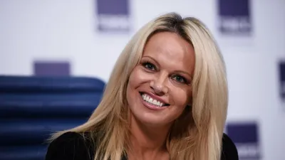 Pamela Anderson, 56, looks as amazing as ever as she slips back into her  iconic red swimsuit | HELLO!