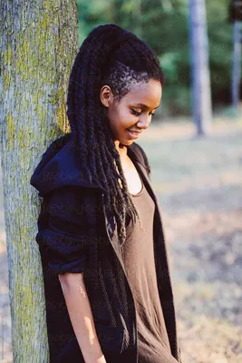 Rasta Woman With Dreadlocks Posing In The Nature At Sunset\" by Stocksy  Contributor \"Vero.\" - Stocksy