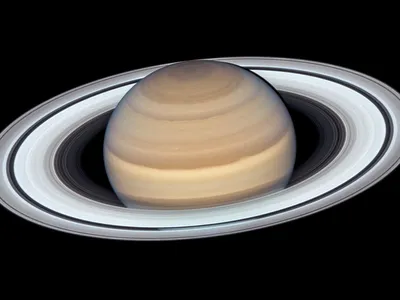 Saturn's icy rings may be giving the planet an ultraviolet glow