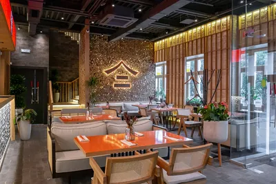 MOSCOW - SEPTEMBER 2014:: Interior Of The Japanese Sushi Restaurant Chain \" TANUKI\". Wooden Tables And Benches Stock Photo, Picture and Royalty Free  Image. Image 139049042.